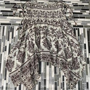 Selling a tank top, size large, cream color, black print, bandanna style print,